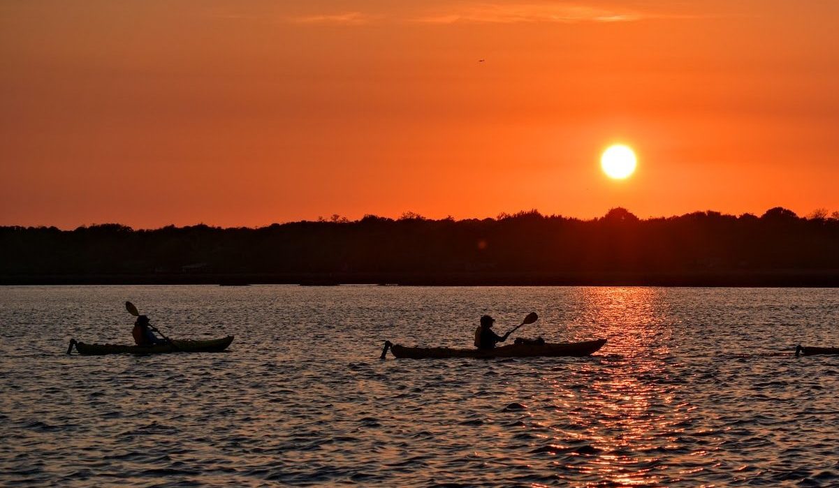 Kayakers at sunset