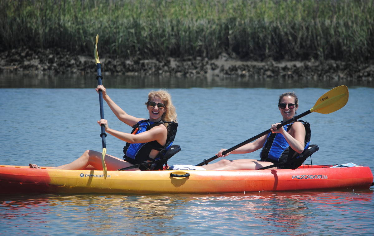 Kayak rental smiling and having a great time on the water.