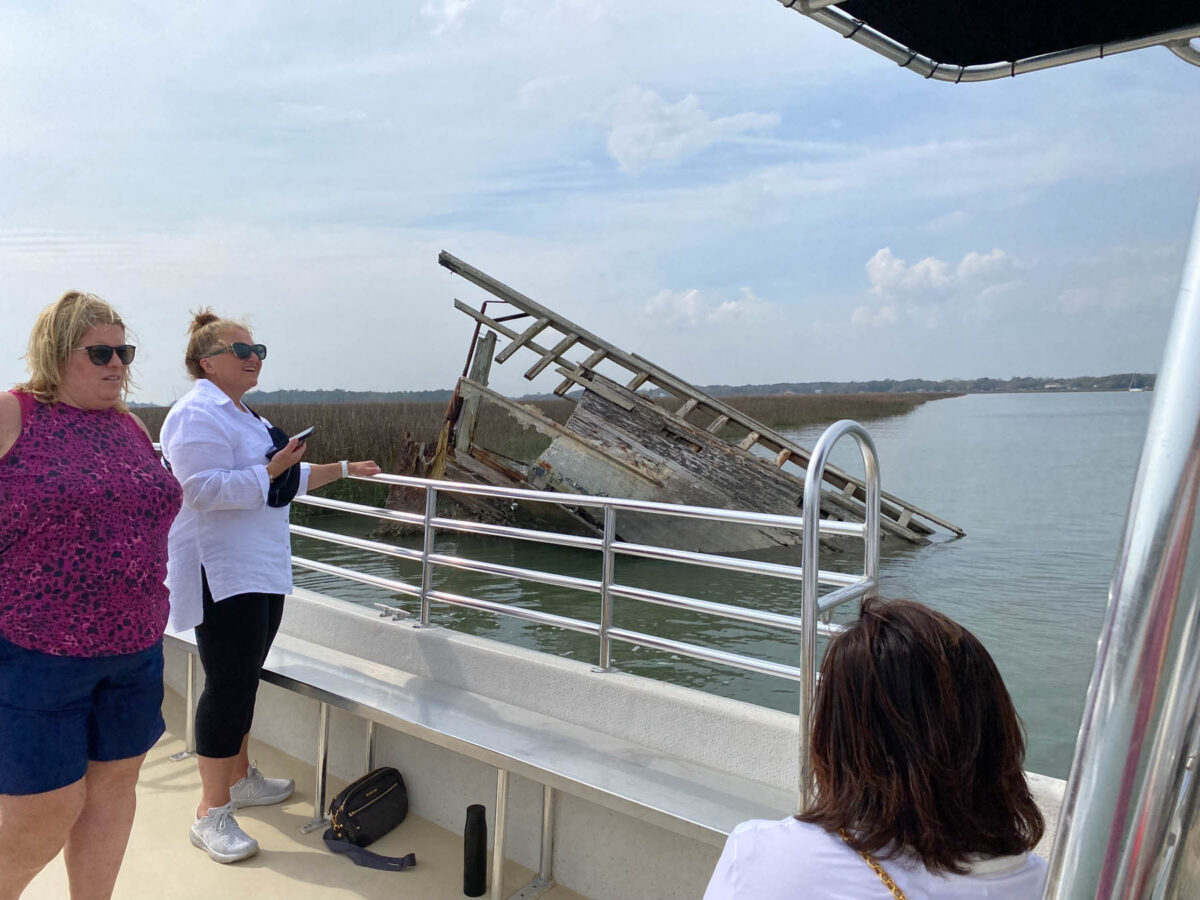 Women view pirate shipwreck off coast of Charleston, SC during COA tour.
